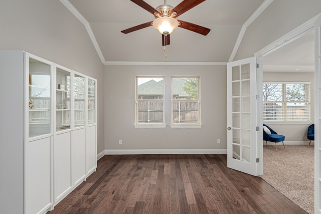 unfurnished room with vaulted ceiling, ornamental molding, and a healthy amount of sunlight