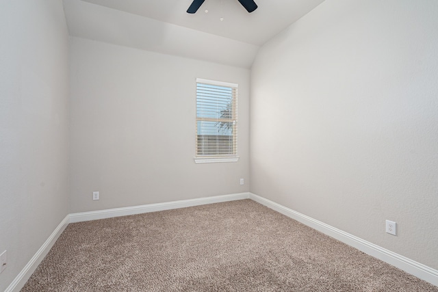 carpeted empty room featuring lofted ceiling and ceiling fan