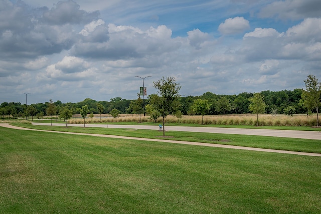 surrounding community featuring a yard