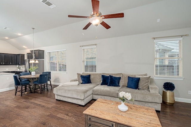 living room featuring ceiling fan, a healthy amount of sunlight, lofted ceiling, and dark hardwood / wood-style floors