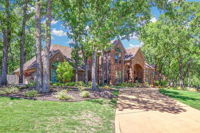 tudor home with a front yard