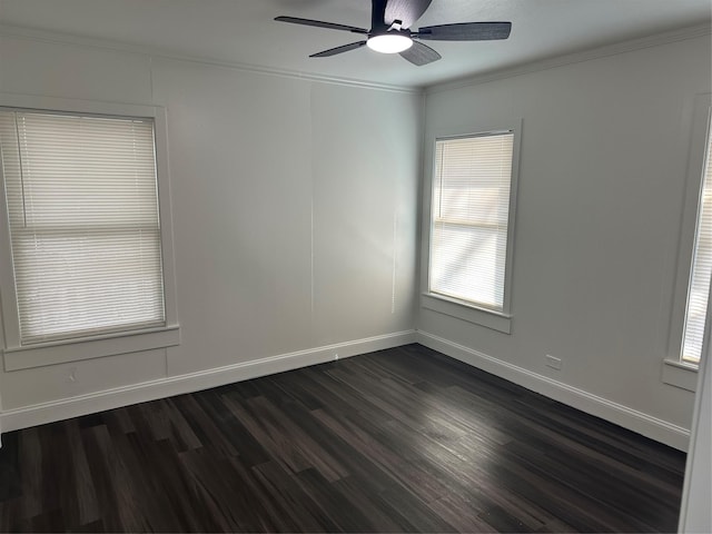 empty room featuring ornamental molding, dark hardwood / wood-style floors, and ceiling fan