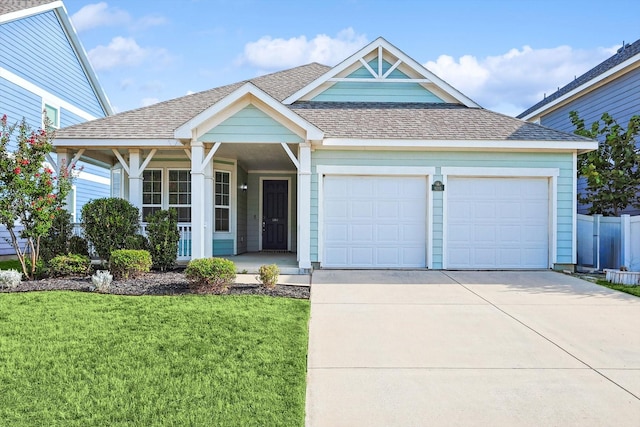 view of front of home featuring a garage and a front lawn