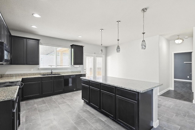 kitchen with sink, a center island, light stone counters, black appliances, and decorative light fixtures