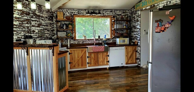 kitchen with sink and white appliances