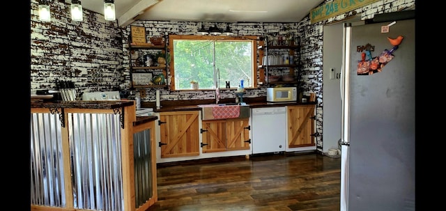 kitchen featuring dark hardwood / wood-style flooring, sink, and white appliances