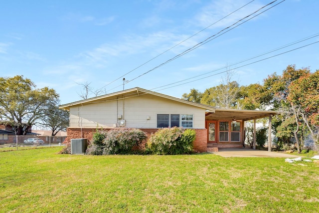 back of property featuring a patio, central AC, fence, a yard, and brick siding