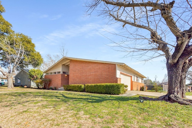 view of home's exterior featuring a garage and a lawn