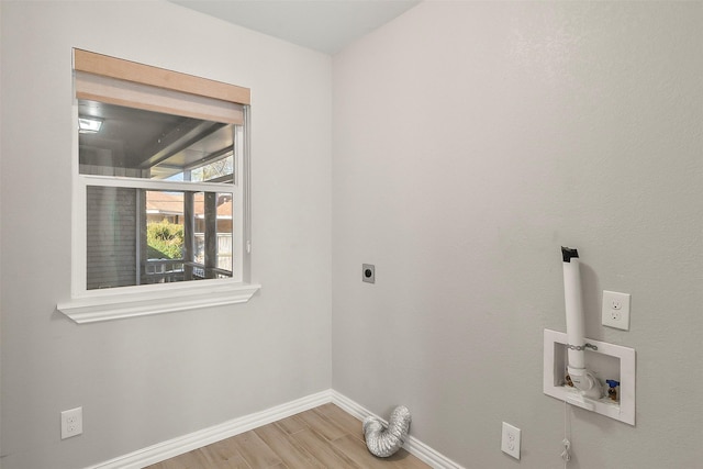 clothes washing area featuring wood-type flooring, hookup for an electric dryer, and hookup for a washing machine