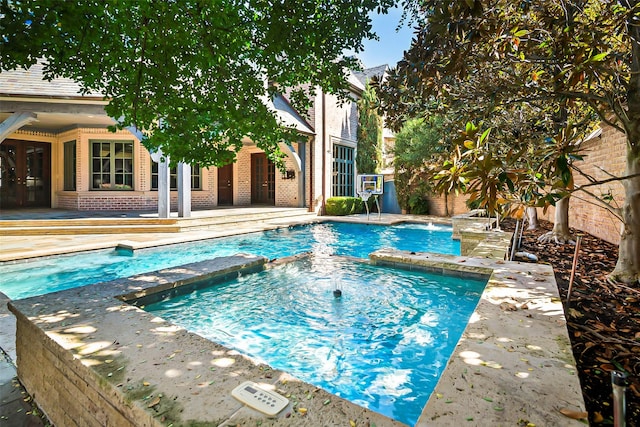 view of swimming pool featuring a patio