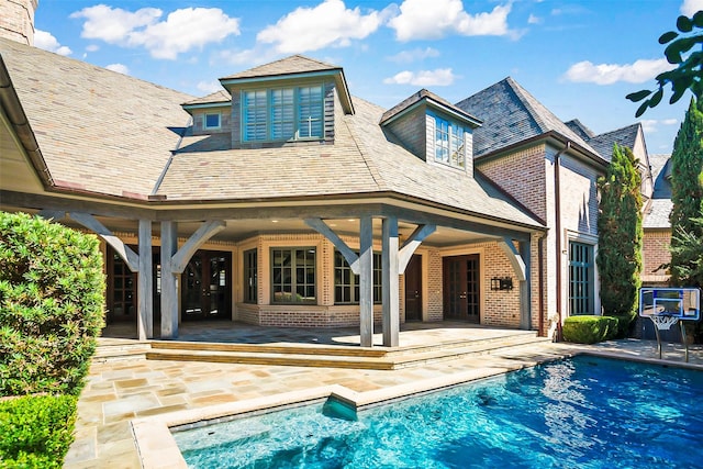 rear view of property featuring a patio