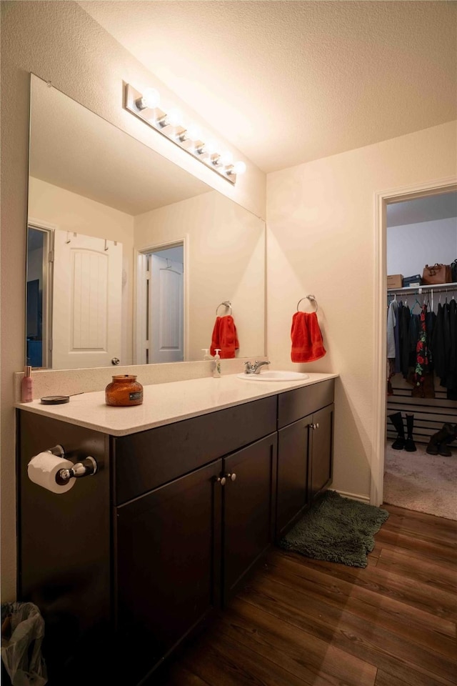 bathroom featuring vanity and hardwood / wood-style floors