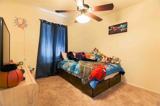 bedroom with light colored carpet and ceiling fan