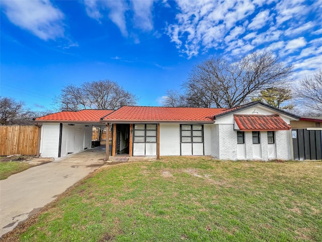 single story home with a carport and a front yard