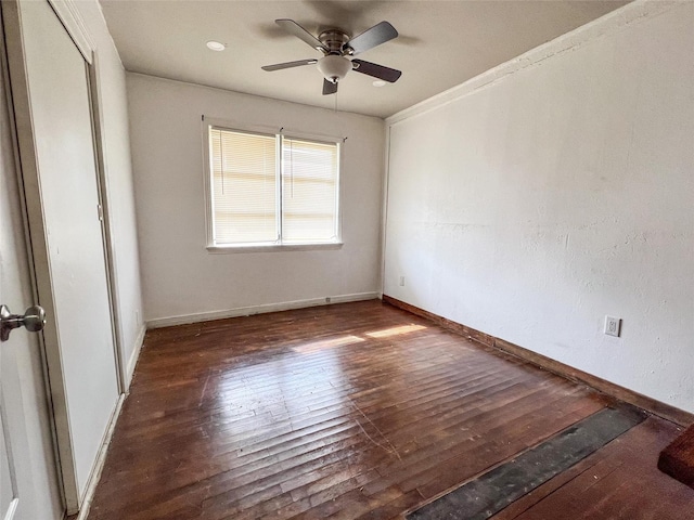 unfurnished room with ceiling fan and dark hardwood / wood-style floors