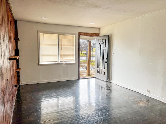 empty room featuring dark wood-type flooring