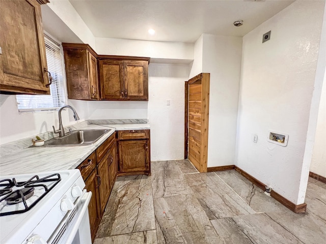 kitchen featuring sink and gas range gas stove