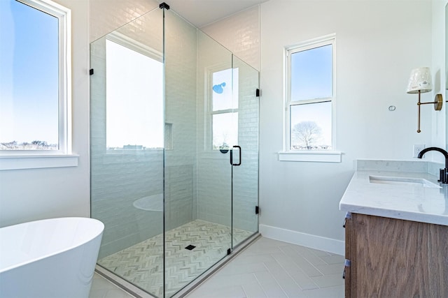 bathroom featuring vanity and shower with separate bathtub