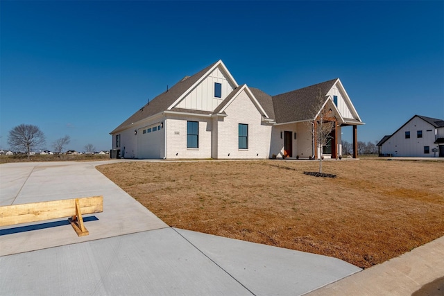 craftsman-style home with a garage and a front lawn