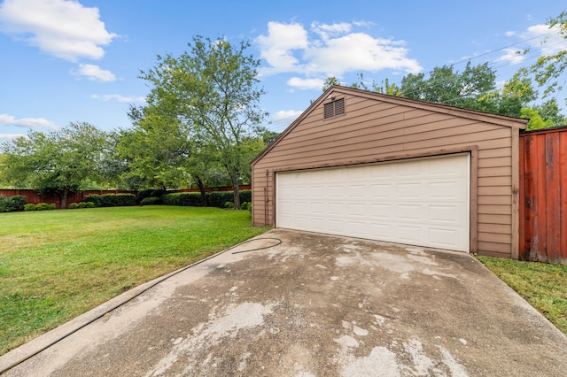 garage with a lawn