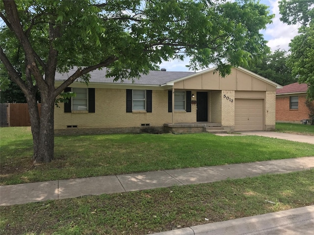 single story home featuring a garage and a front lawn