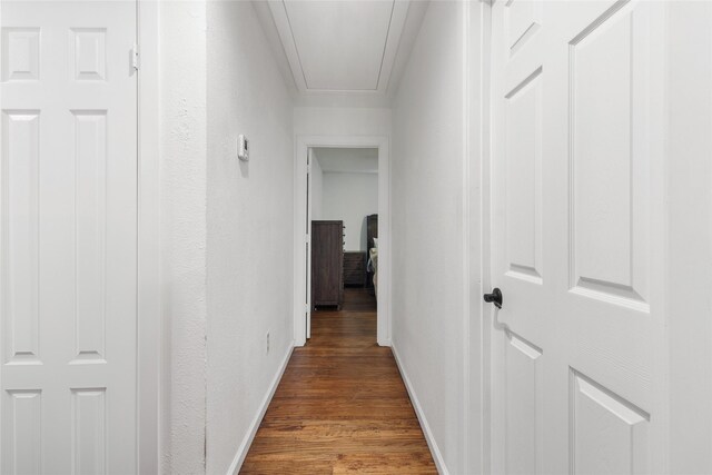 420 S Evans St, Boyd, TX 76023 - corridor with attic access, dark wood-style flooring, baseboards, and a textured wall