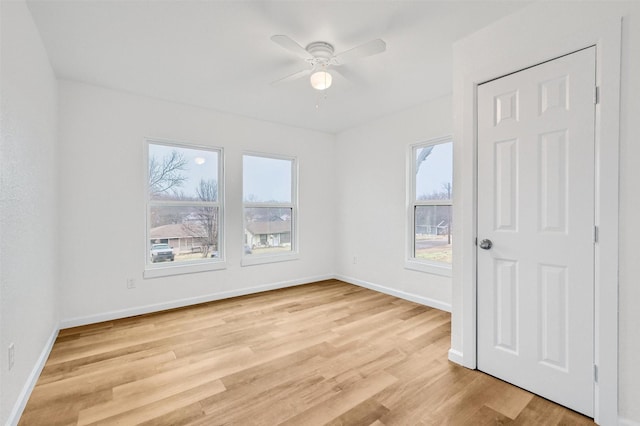 unfurnished room with ceiling fan and light hardwood / wood-style flooring