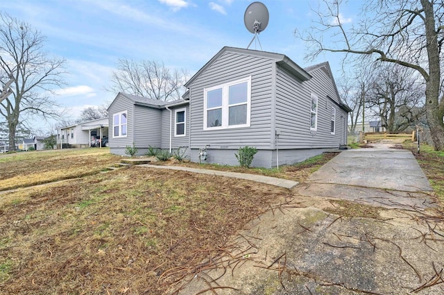 view of side of property with a yard