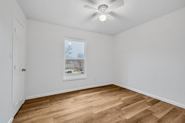 spare room with ceiling fan and hardwood / wood-style floors