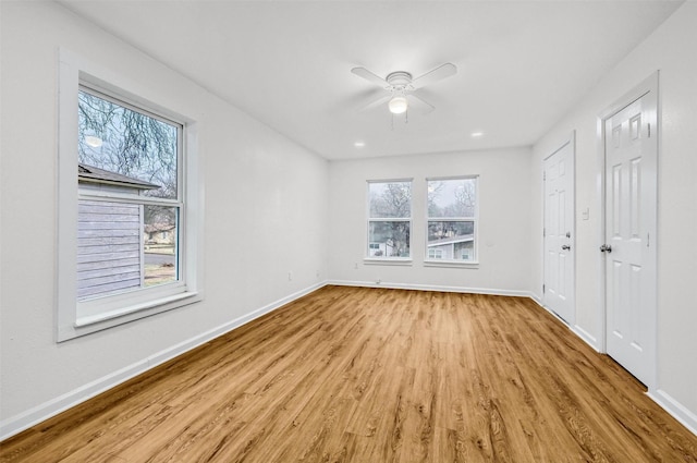 unfurnished bedroom featuring ceiling fan and light wood-type flooring