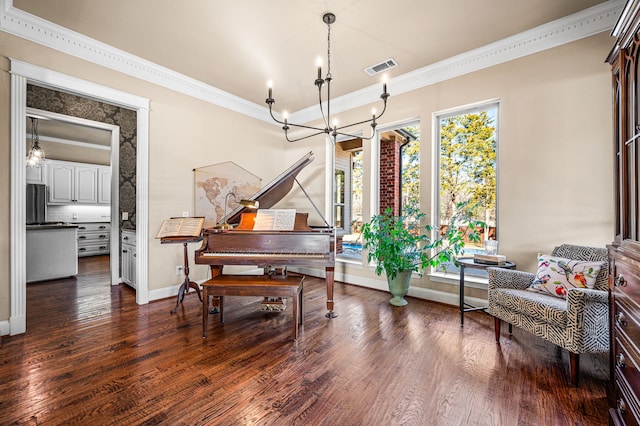 miscellaneous room featuring an inviting chandelier, crown molding, and dark hardwood / wood-style flooring