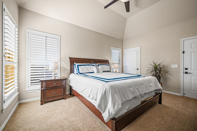 carpeted bedroom featuring ceiling fan and vaulted ceiling