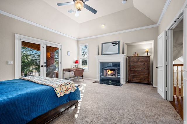 bedroom with a tile fireplace, lofted ceiling, carpet, access to outside, and crown molding