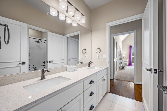 bathroom featuring vanity, curtained shower, and tile patterned floors