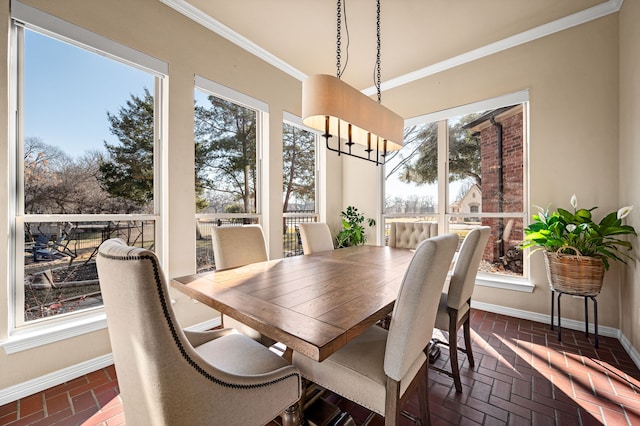 dining area featuring crown molding