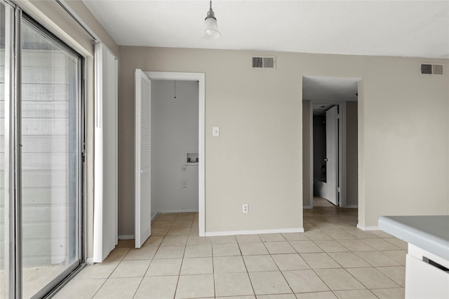 interior space with light tile patterned floors