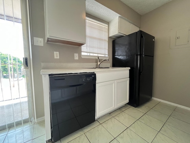 kitchen with sink, white cabinetry, a textured ceiling, light tile patterned floors, and black appliances