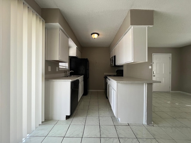 kitchen featuring black appliances, sink, white cabinets, kitchen peninsula, and a textured ceiling