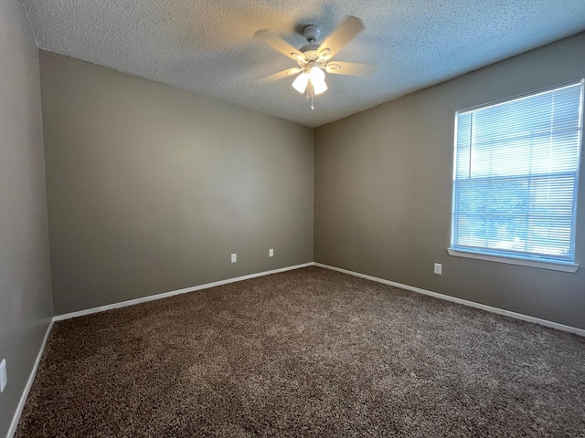 unfurnished room with carpet flooring, a textured ceiling, and ceiling fan