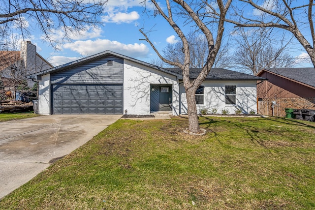 ranch-style home with a garage and a front lawn