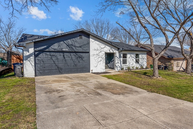 ranch-style house featuring a garage and a front yard