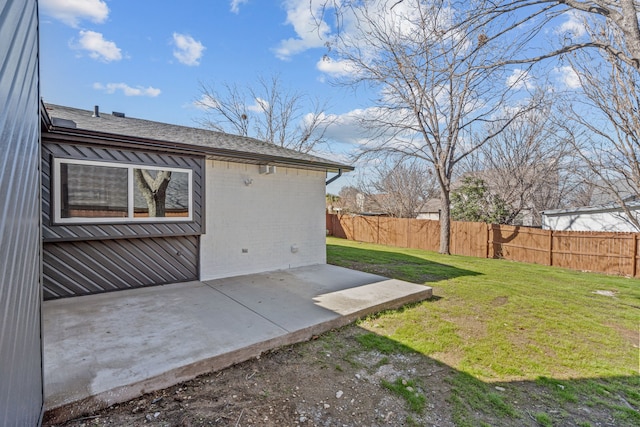 exterior space with a lawn and a patio