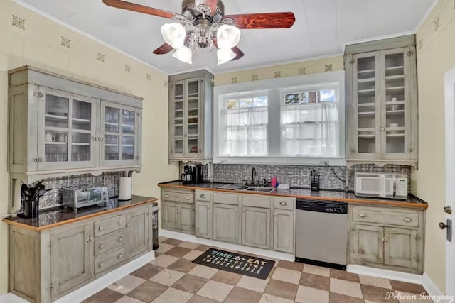 kitchen with tasteful backsplash, ornamental molding, dishwasher, and sink