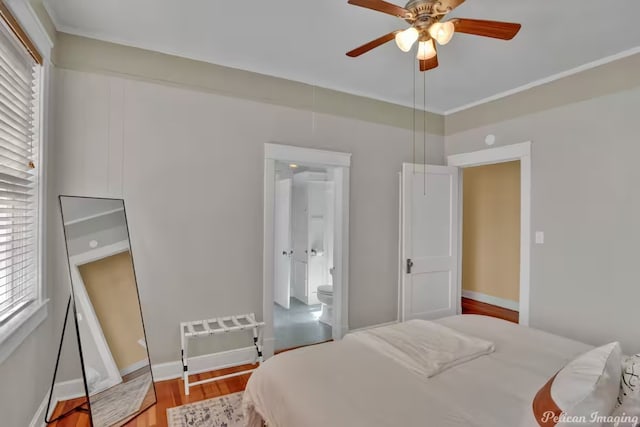 bedroom with ceiling fan, wood-type flooring, and ensuite bathroom