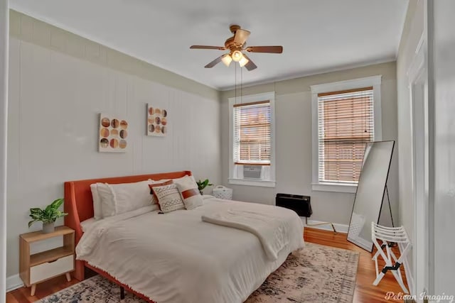 bedroom featuring ceiling fan and light hardwood / wood-style floors