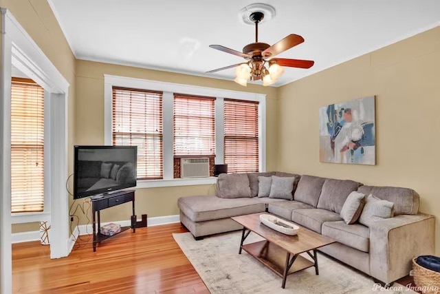 living room with hardwood / wood-style flooring, plenty of natural light, cooling unit, and ceiling fan