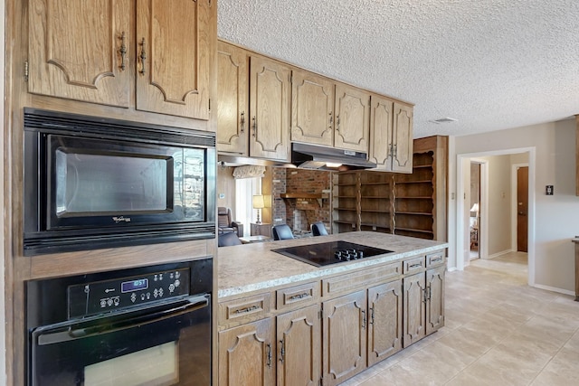 kitchen featuring black appliances and a textured ceiling