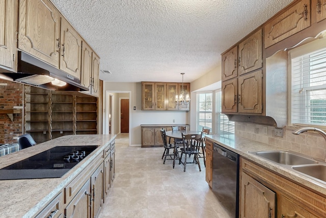 kitchen with pendant lighting, sink, black appliances, decorative backsplash, and a chandelier