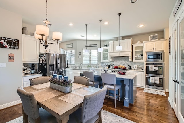 dining space with dark wood-type flooring