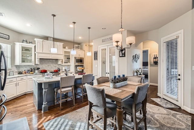 dining space with hardwood / wood-style flooring